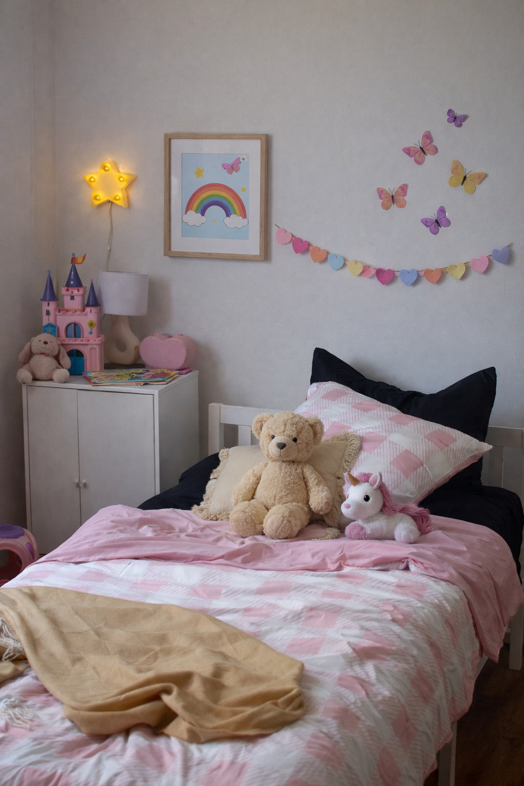 Children's bedroom with pink and white check bedding, toys, and decorative elements.