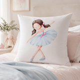 A continental white  pillow featuring a watercolor illustration of a young ballerina in a light blue tutu with pink accents, styled on a bed in a soft, neutral bedroom setting.