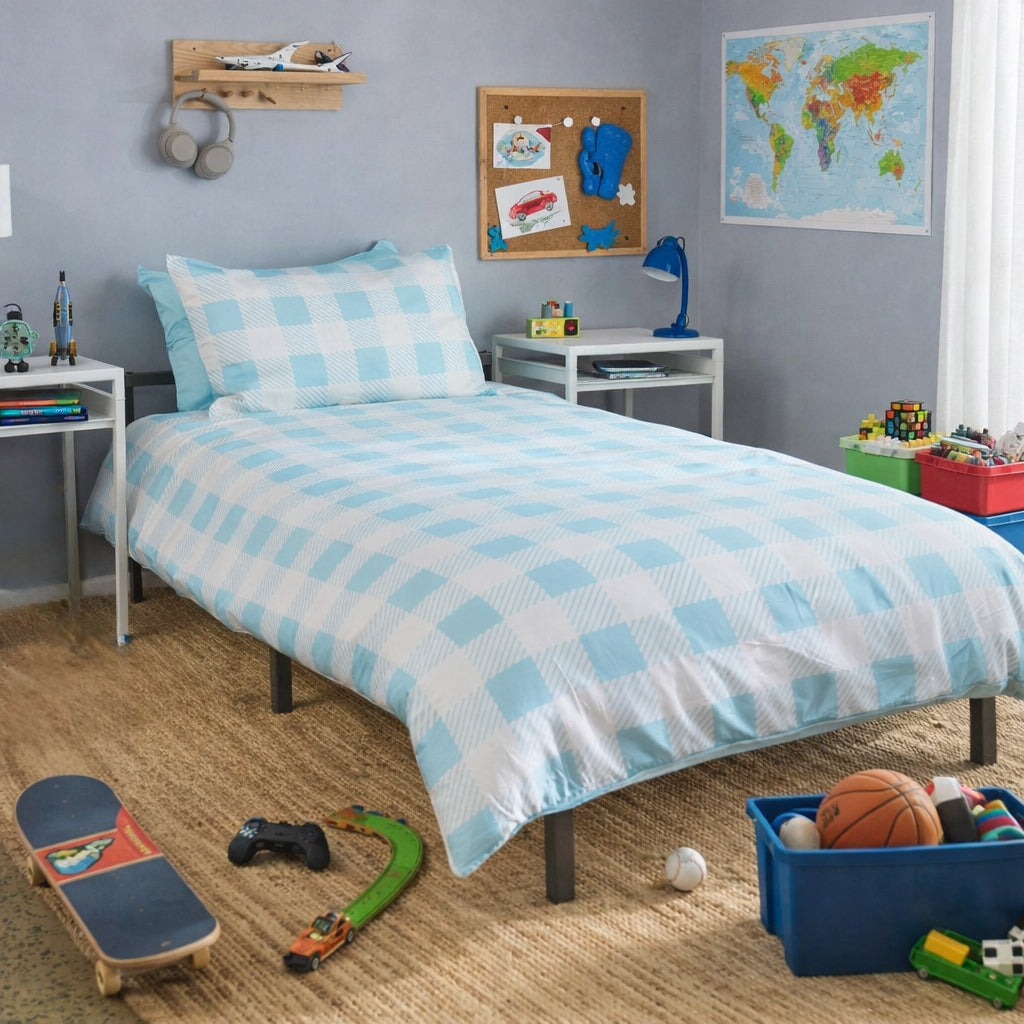 A single bed dressed in a light blue and white gingham check duvet cover and matching pillowcases, styled in a child's bedroom with toys, a skateboard, a map on the wall, and bedside tables.