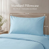 A light blue standard pillowcase shown on a bed with matching bedding, with overlaid text and dimension arrows indicating 70 cm by 45 cm measurements.