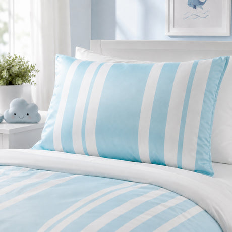 A light blue and white striped pillowcase displayed on a bed with matching striped bedding, in a bright, modern bedroom setting.