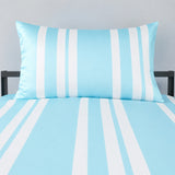 A light blue and white striped bedding set featuring a matching pillowcase and sheet on a bed frame, shown against a neutral gray wall.