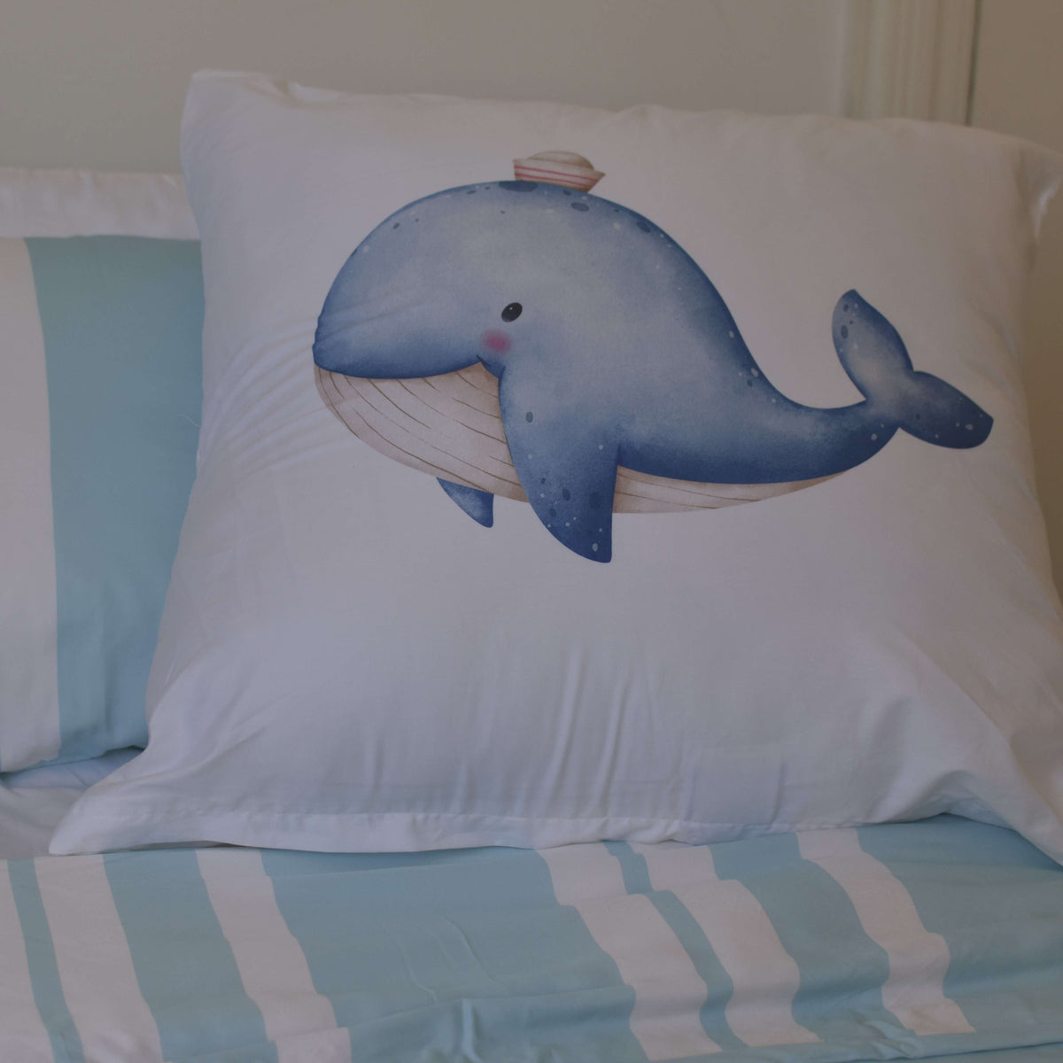 Bruno the whale kid's continental pillowcase in blue watercolor