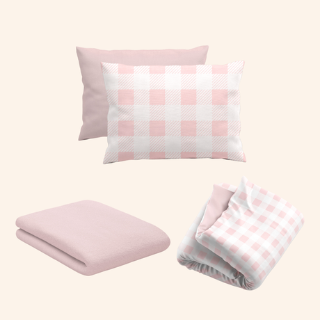 rose quartz pink gingham bamboo bedding bundle styled on kids bed setup