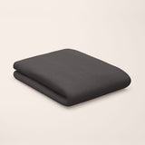 deep black flat sheet styled on kids bed setup