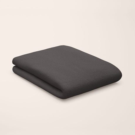deep black flat sheet styled on kids bed setup