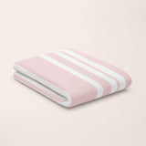 rose quartz pink & white stripe bamboo flat sheet styled on kids bed setup