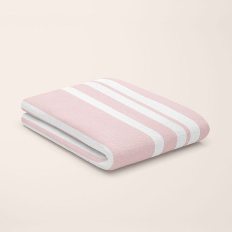 rose quartz pink & white stripe bamboo flat sheet styled on kids bed setup