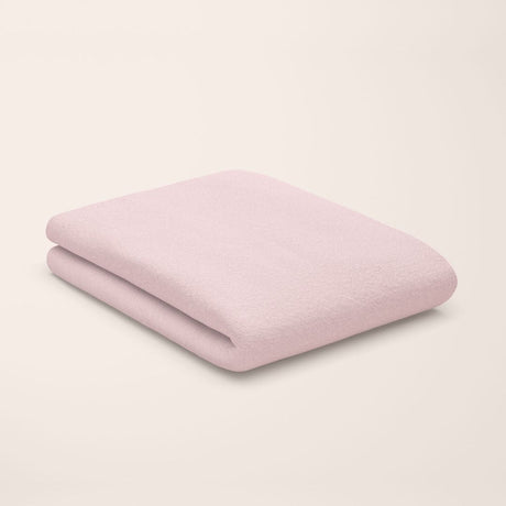 rose quartz pink flat sheet styled on kids bed setup