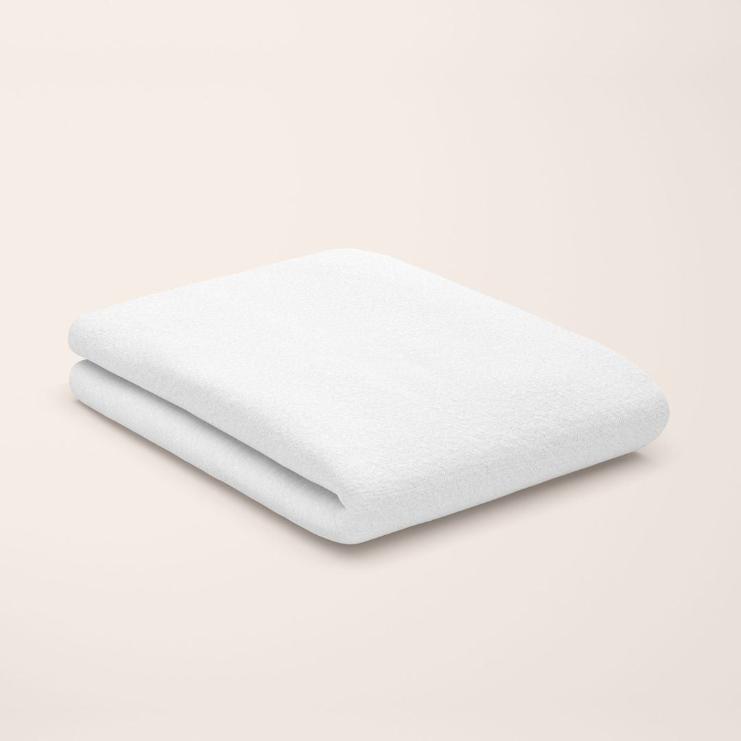 snowy white flat sheet styled on kids bed setup