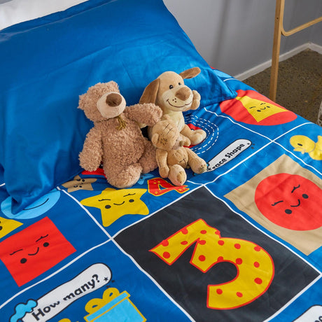 Children's maths themed duvet cover set with toys on a bed