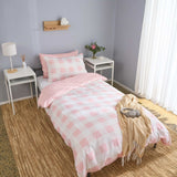 rose quartz gingham check pink and white bamboo duvet cover styled on kids bed setup