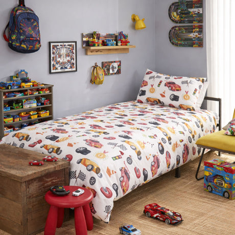 race car dreams reversible kids duvet cover set styled on kids bed setup