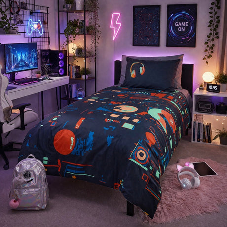 Gaming room with colorful technology themed bedding, desk, and neon lights