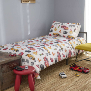 Duvet cover with racing car designs on a bed with cars on the carpet